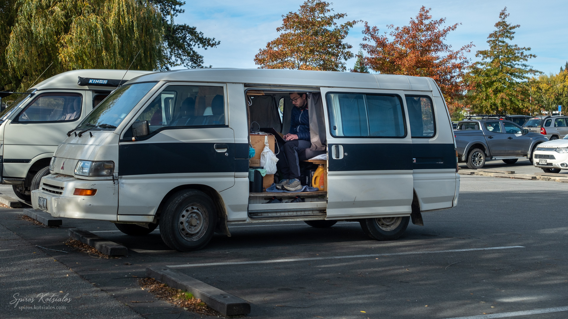 Camper or digital Nomad in the carpark catching up